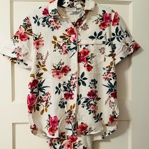 Brand new never worn pajamas in a rose pattern. 56% cotton/44% viscose.